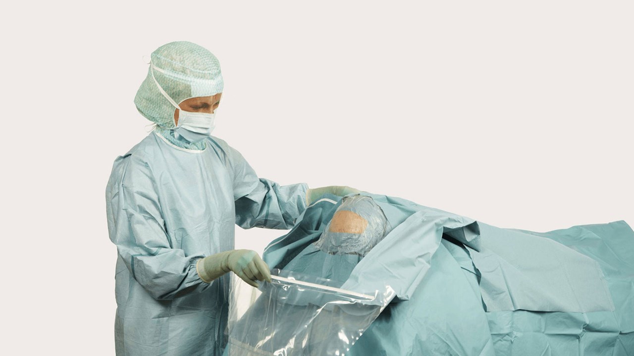 a female surgeon using a BARRIER Neurosurgery drape